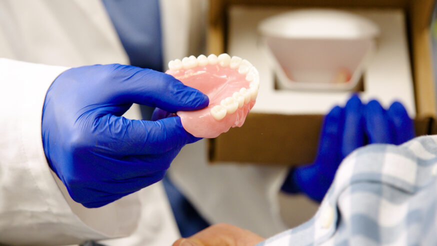 dandy dentist delivering dentures